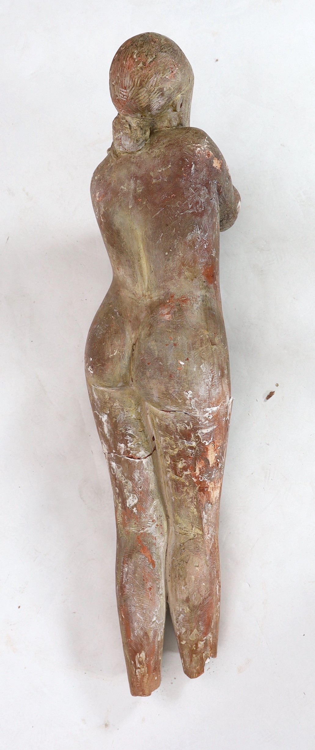 In the manner of Marino Marini, a terracotta sculpture, reclining female nude Length 120cm.